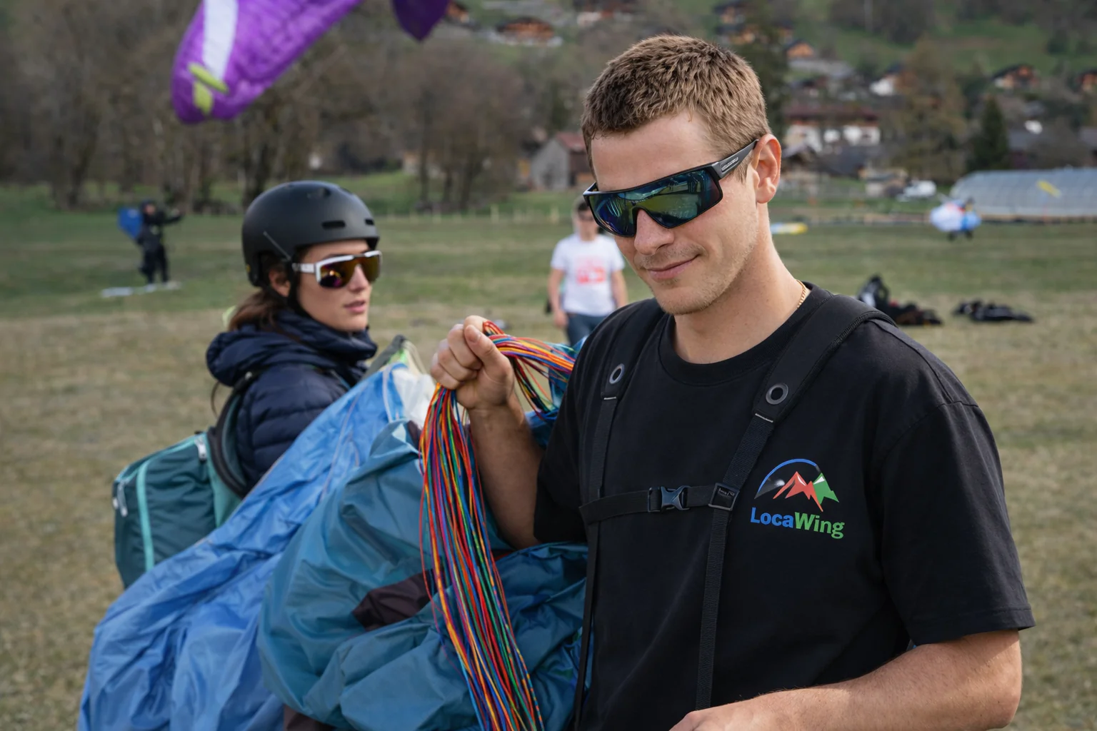 Paragliding team preparing for takeoff